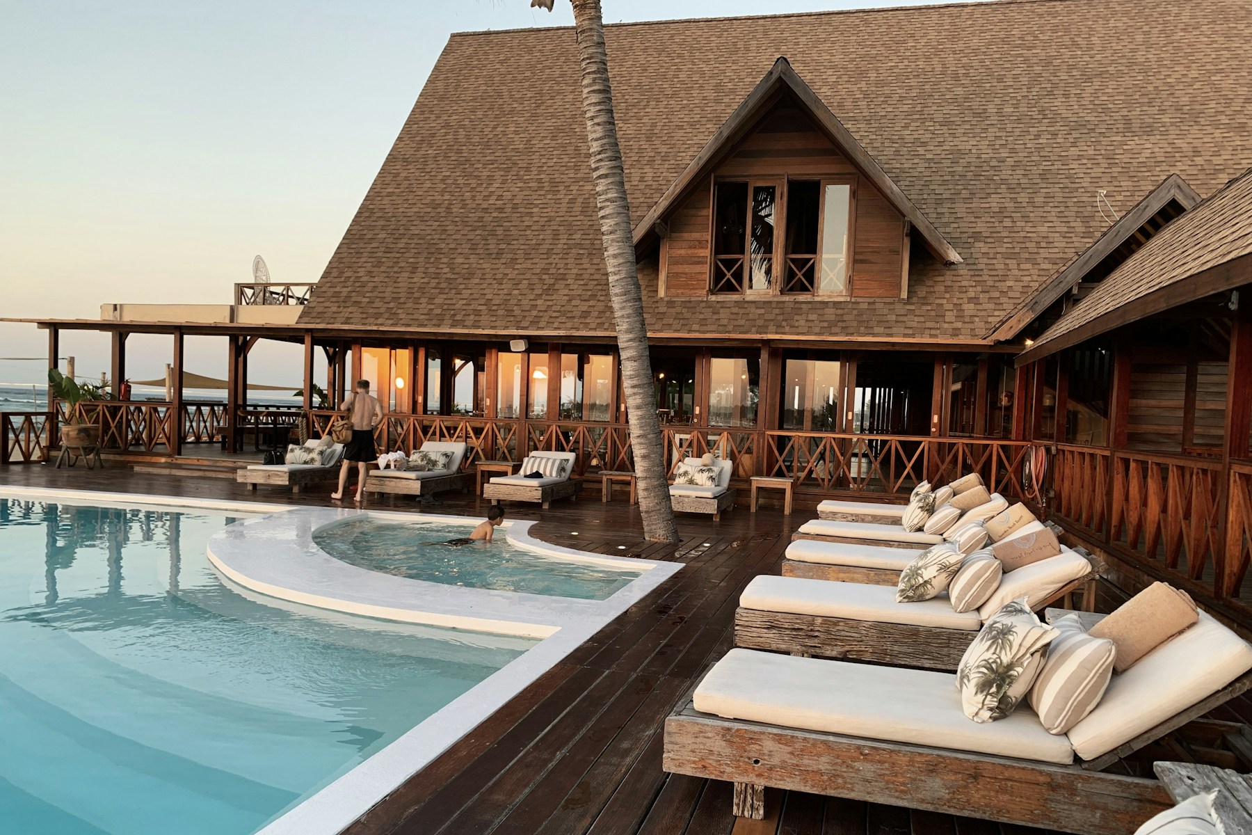 Palm-lined hotel overlooking the water